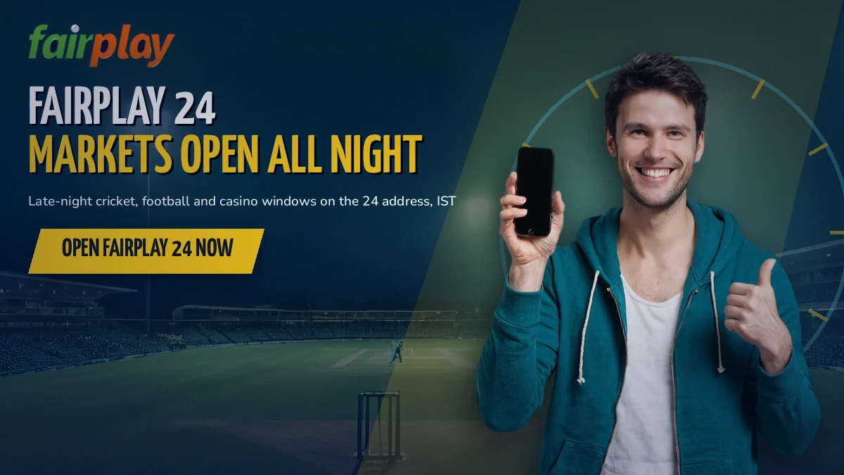 Cricket fan checking late night FairPlay 24 markets on a phone under stadium floodlights