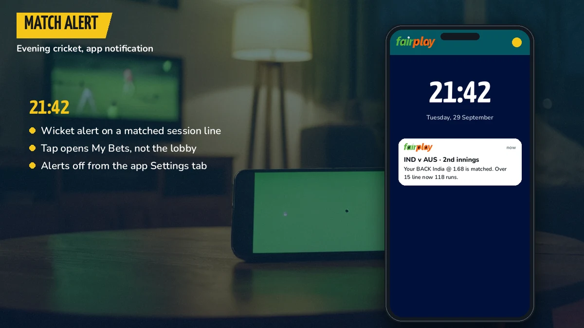 Phone on a table with a FairPlay app match alert arriving during an evening cricket game