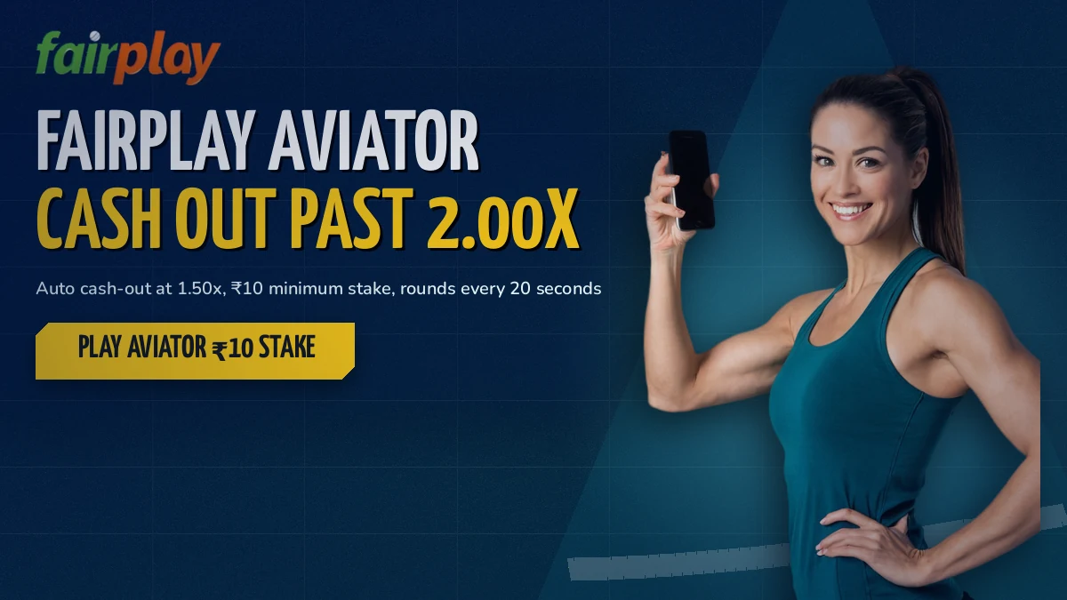Smiling adult fan holding one phone as a crash multiplier climbs past 2x on the FairPlay aviator screen